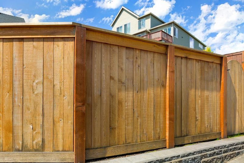 New cedar wood privacy fence installed behind a home in Boise, Idaho